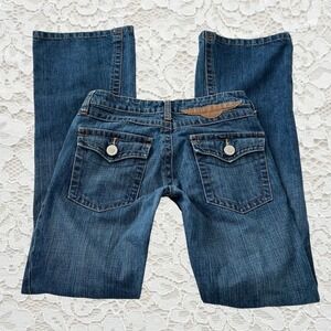 vintage bcbg low rise bootcut jeans with cute wing leather patch & butt pockets